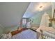 Peaceful Bedroom with a crib, chair, and accents in soft neutral tones at 609 4Th Sw Ave, Ruskin, FL 33570