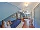 Bright and airy blue bedroom with wood floors, white ceiling, bed, and bright, natural light at 609 4Th Sw Ave, Ruskin, FL 33570