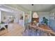Dining room with hardwood floors, stylish furnishings, and open access to the living room and kitchen at 609 4Th Sw Ave, Ruskin, FL 33570