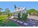 Beautiful home with a lush front yard and covered porch, offering curb appeal and charm at 609 4Th Sw Ave, Ruskin, FL 33570
