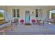 Cozy front porch with swing seating, perfect for relaxing and enjoying the outdoors at 609 4Th Sw Ave, Ruskin, FL 33570
