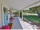 Inviting front porch showcasing swing seating and a welcoming entrance at 609 4Th Sw Ave, Ruskin, FL 33570