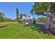 Quaint two-story home with a well-manicured lawn, front porch swings, and curb appeal at 609 4Th Sw Ave, Ruskin, FL 33570