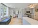 Open kitchen with gray cabinets, quartz countertops, stainless steel appliances, and a view into the living room at 609 4Th Sw Ave, Ruskin, FL 33570