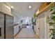 Open kitchen with gray cabinets, stainless steel appliances, a center island, and a view into the living room at 609 4Th Sw Ave, Ruskin, FL 33570