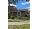 Charming exterior view showcasing the landscaped front yard and inviting facade of the home at 7112 Eldorado Dr, Tampa, FL 33615