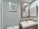 Well lit bathroom features a decorative mirror, updated sink, and modern lighting at 803 Bahia Del Sol Dr # 66, Ruskin, FL 33570