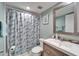Bathroom with a sink vanity, starfish shower curtain, and modern fixtures at 803 Bahia Del Sol Dr # 66, Ruskin, FL 33570