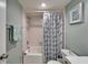 Cozy bathroom featuring a shower-tub combination with a decorative starfish-themed curtain at 803 Bahia Del Sol Dr # 66, Ruskin, FL 33570