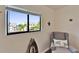 Bedroom features a bright window with a view and a comfy reading chair at 803 Bahia Del Sol Dr # 66, Ruskin, FL 33570