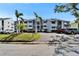 Exterior shot of condo complex with lush landscaping and ample parking at 803 Bahia Del Sol Dr # 66, Ruskin, FL 33570