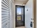 Hallway area with tiled flooring and a louvered door closet on the left at 803 Bahia Del Sol Dr # 66, Ruskin, FL 33570