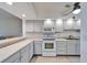 This kitchen features clean white countertops and cabinets at 803 Bahia Del Sol Dr # 66, Ruskin, FL 33570