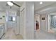 Galley kitchen featuring white cabinetry and modern appliances at 803 Bahia Del Sol Dr # 66, Ruskin, FL 33570