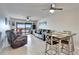 Spacious living room with tile floors, ceiling fans, and a glass sliding door to the patio at 803 Bahia Del Sol Dr # 66, Ruskin, FL 33570