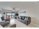Inviting living room with tile floors, glass sliding doors leading to a patio, and comfortable seating at 803 Bahia Del Sol Dr # 66, Ruskin, FL 33570
