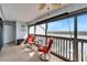 Enjoy water views from the cozy patio with a fan, table, and chairs at 803 Bahia Del Sol Dr # 66, Ruskin, FL 33570