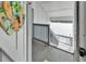 Stairway with weathered wooden railing leads down with view of the water and docks at 803 Bahia Del Sol Dr # 66, Ruskin, FL 33570
