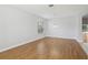 Empty room with hardwood floors, recessed lights, and glass doors to screened patio at 8847 Bel Meadow Way, Trinity, FL 34655