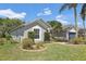 Well-manicured front yard with lush lawn and trimmed landscaping surrounding the home at 8847 Bel Meadow Way, Trinity, FL 34655
