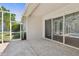 Covered lanai offers an extension of the indoor living space with tiled flooring at 8847 Bel Meadow Way, Trinity, FL 34655