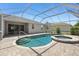 Outdoor pool and spa in a screened lanai with landscaped backyard at 8847 Bel Meadow Way, Trinity, FL 34655