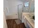 Clean bathroom with a soaking tub, separate shower, modern fixtures, and ample counter space at 10275 Oasis Palm Dr, Tampa, FL 33615