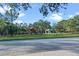Community park featuring a playground, covered picnic area, walking paths, and ample green space at 10275 Oasis Palm Dr, Tampa, FL 33615