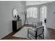 Bright and airy living room with modern furnishings, arched doorway, and wood-look flooring at 10275 Oasis Palm Dr, Tampa, FL 33615