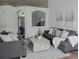 Bright living room featuring modern decor, hardwood floors, and large windows for lots of light at 10275 Oasis Palm Dr, Tampa, FL 33615