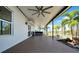 Spacious back porch with a ceiling fan, hot tub, and water view at 10612 Strawberry Tetra Dr, Riverview, FL 33578