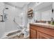 Bright bathroom featuring a walk-in shower, white subway tile, a granite countertop, and a vessel sink at 10612 Strawberry Tetra Dr, Riverview, FL 33578