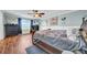 Inviting bedroom with dark wood furniture, soft blue walls and a ceiling fan at 10612 Strawberry Tetra Dr, Riverview, FL 33578
