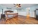 Inviting bedroom with dark wood furniture, light blue walls, and a ceiling fan at 10612 Strawberry Tetra Dr, Riverview, FL 33578
