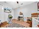 Well-lit bedroom with wood-look floors, neutral walls and a ceiling fan at 10612 Strawberry Tetra Dr, Riverview, FL 33578