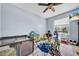 A light blue-walled playroom with a window is filled with toys and games, creating a fun and inviting space at 10612 Strawberry Tetra Dr, Riverview, FL 33578