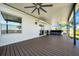 Covered patio with fan and hot tub at 10612 Strawberry Tetra Dr, Riverview, FL 33578