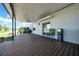 Enjoy the covered patio with fan and sliding door access to the lush, green yard at 10612 Strawberry Tetra Dr, Riverview, FL 33578