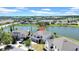 Lovely home with manicured lawn and a view of the lake at 10612 Strawberry Tetra Dr, Riverview, FL 33578