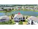 A charming two-story home with a well-manicured lawn and lovely water views at 10612 Strawberry Tetra Dr, Riverview, FL 33578