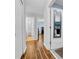 Hallway view to the laundry, bath and bedroom, featuring modern lighting and neutral walls at 10612 Strawberry Tetra Dr, Riverview, FL 33578