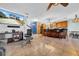 Open floor plan showing the living room, kitchen and dining area with hardwood cabinets at 10612 Strawberry Tetra Dr, Riverview, FL 33578