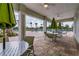 Covered outdoor patio with tables and chairs overlooking the community pool at 10612 Strawberry Tetra Dr, Riverview, FL 33578