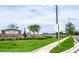 Community entrance sign surrounded by lush green landscaping at 10612 Strawberry Tetra Dr, Riverview, FL 33578