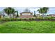 A stone sign that reads 'The Summit at Wekiva Hills' surrounded by greenery and palm trees at 10612 Strawberry Tetra Dr, Riverview, FL 33578