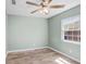Bedroom features neutral paint, wood-look floors, and ceiling fan at 10790 92Nd St, Seminole, FL 33777