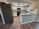 Bright kitchen features granite countertops, stainless steel appliances, and a skylight at 10790 92Nd St, Seminole, FL 33777