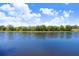 Scenic lake view with lush green trees and a serene water surface at 10790 92Nd St, Seminole, FL 33777