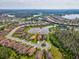 Wide aerial view of a residential area with numerous homes, lakes, and recreational facilities at 11248 Juglans Dr, Odessa, FL 33556