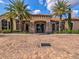 Community clubhouse featuring a brick driveway, stone accents, and well-maintained landscaping at 11248 Juglans Dr, Odessa, FL 33556